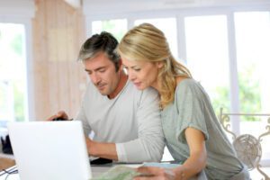 Mature couple reading Ten Step to Buying a Home