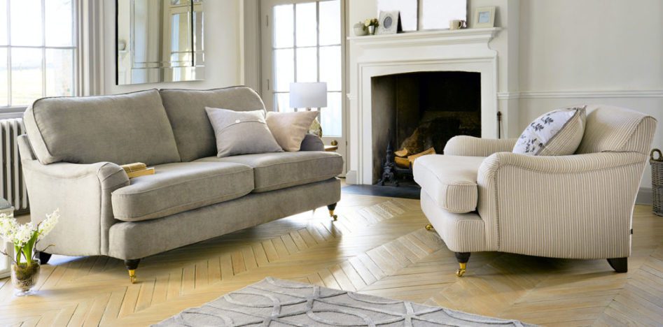 light colored sofa on hard wood floor in luxury home
