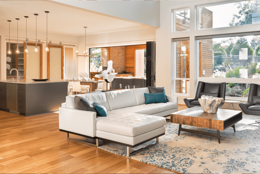 Beautiful living room with hardwood flooring and white sofa