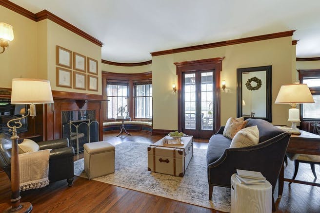 Summit Hill Property, interior, beautiful classic wood panel around fireplace. Gorgeous room