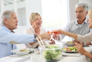 Four senior citizens having dinner