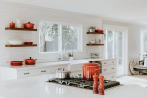 kitchen in white with red accessories. going green, green, green kitchen